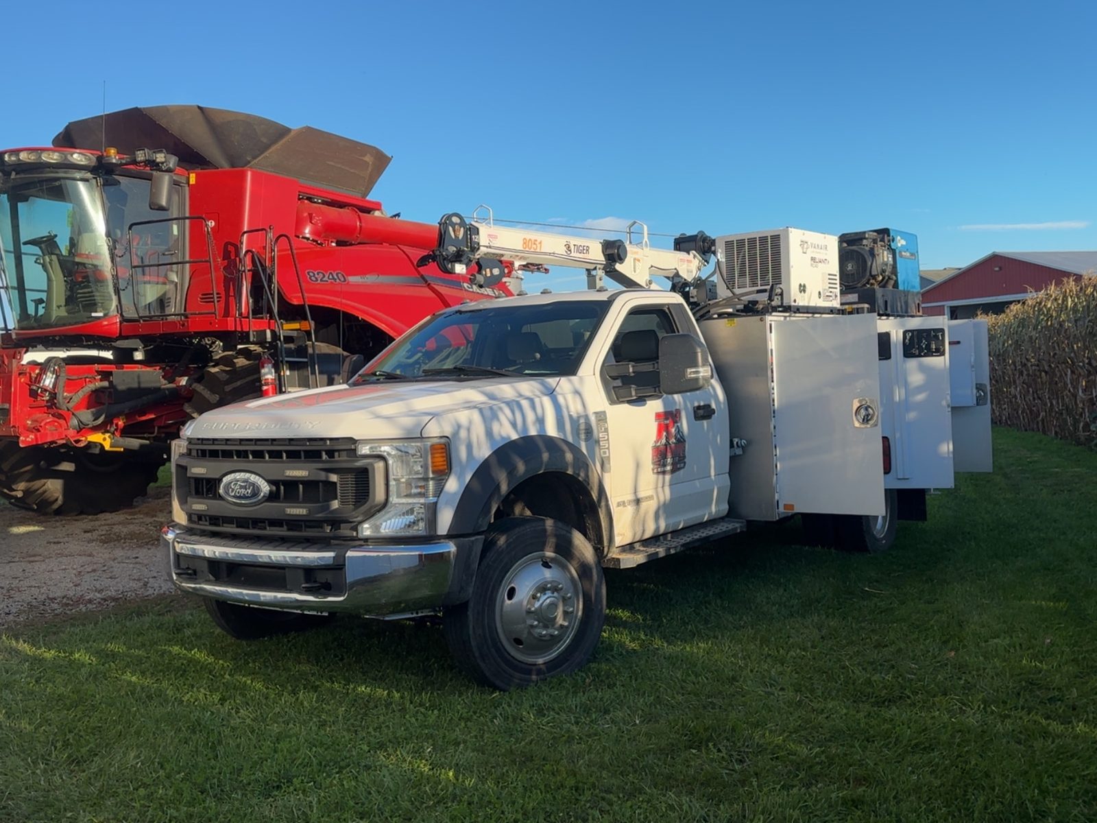Red Ridge Repair mobile service truck repairing a combine harvester, Utica Ohio